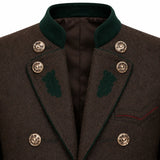 Close-up of a dark brown textured wool coat with a dark green velvet collar, green embroidered leaf details on the lapels, and ornate gold buttons.