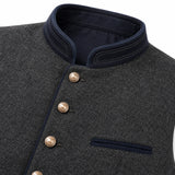 Close-up of a dark gray textured wool vest with a dark navy stand collar, double-breasted buttons, and a matching navy chest pocket.