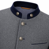Close-up of a gray textured jacket with a dark navy stand collar, decorative metal buttons, and a gingham lining visible inside the collar.