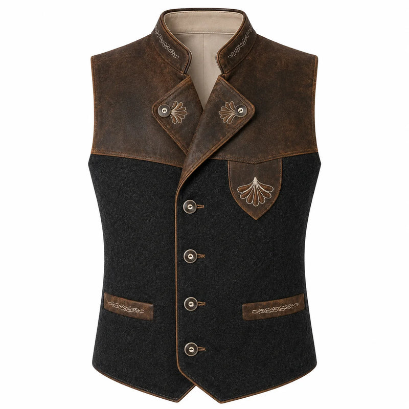 A men's traditional German dirndl vest featuring a dark charcoal gray wool body, dark brown leather shoulder panels and pocket trims, and embroidered details on the chest and collar.