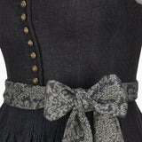 Black dress with gold buttons and a patterned belt on a plain background