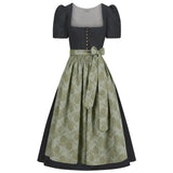 Two-piece dress with a patterned dirndl skirt and polka dot top on a white background