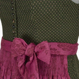 Green Dirndl dress close-up with a pink apron 