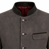 Close-up of a dark gray textured jacket with a mandarin collar, three front buttons, and a chest pocket, showing a burgundy lining inside the collar.