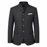 A dark gray textured wool-blend blazer with a mandarin collar, brown buttons, and a white pocket square, shown on a plain white background.