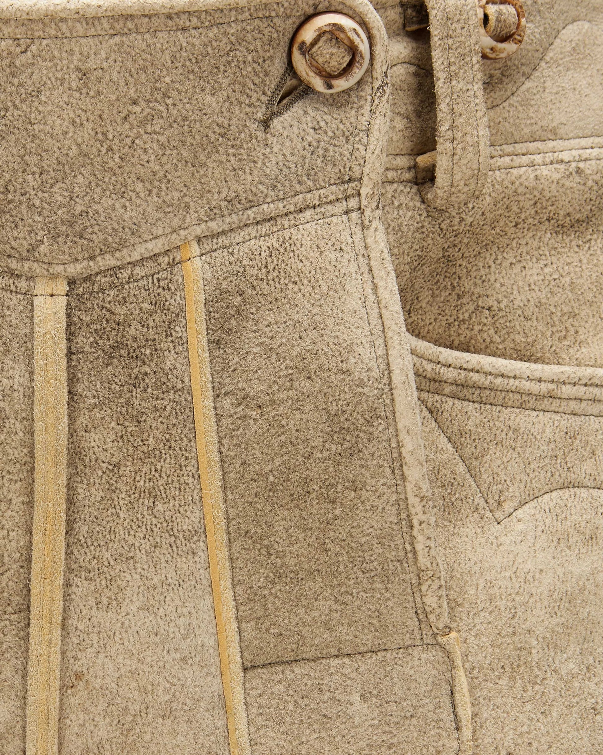 Close-up of beige fabric with stitching details