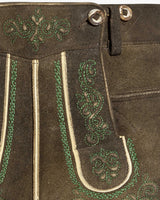 Brown leather pants with green embroidery and white stitching