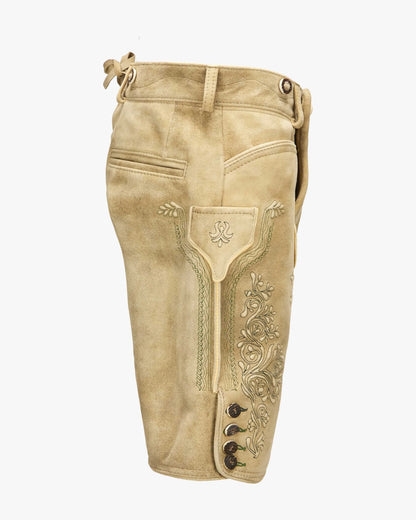 Beige leather riding pants with decorative stitching on a white background