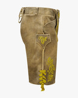 Brown leather shorts with yellow embroidery on a white background