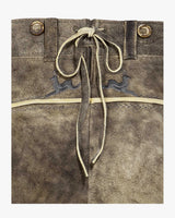 Brown leather bag with drawstring and embroidered designs on a white background