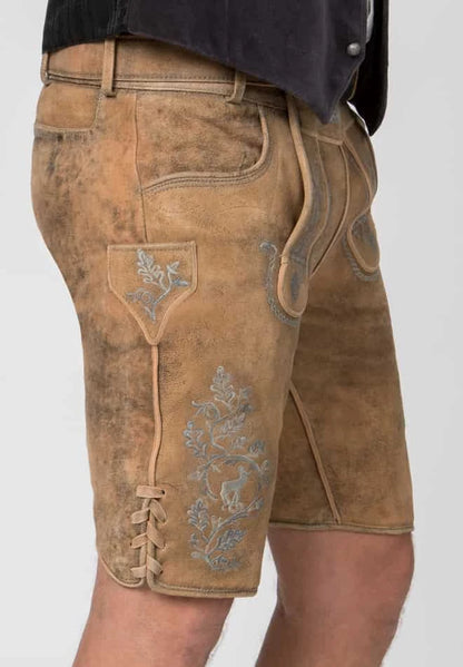 Brown leather shorts with floral embroidery on a white background