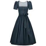 Navy polka dot dress with a white top on a white background