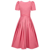 pink dirndl dress with white background 