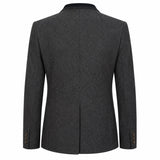 A dark gray textured wool blazer shown from the back, featuring a subtle heathered pattern, structured shoulders, and button details on the cuffs, set against a plain white background.
