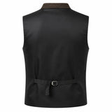 Black sleeveless vest with a brown textured collar and a matching tie belt with a silver buckle, shown from the back on a white background.
