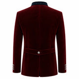 A men's longline velvet blazer shown from the back, featuring a deep burgundy red color, a matching waist belt with a single silver button, and decorative silver buttons on the cuffs, set against a plain white background.