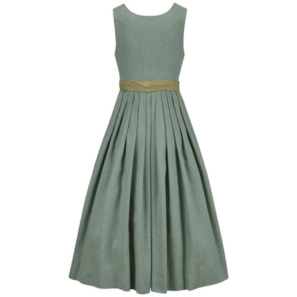 Green dress with a gold belt on a white background