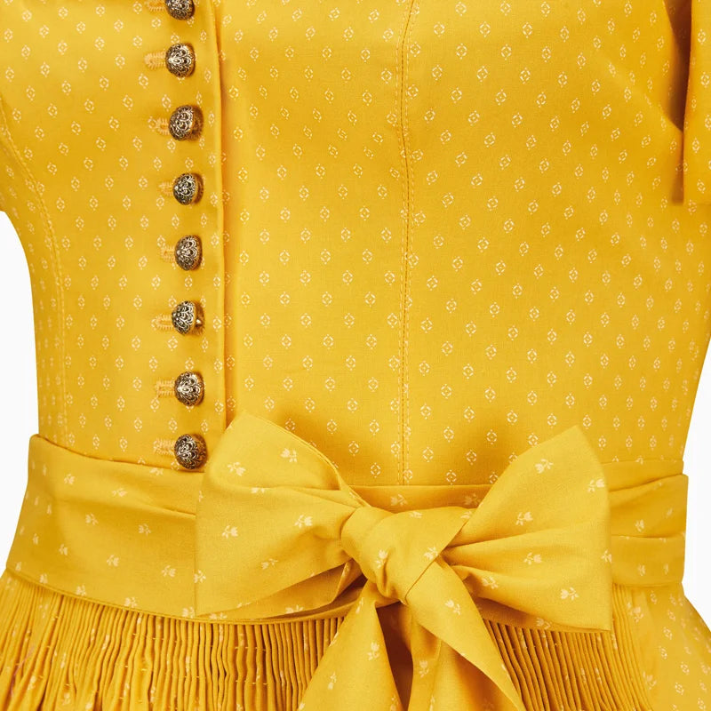 Yellow dress with a bow detail on a white background