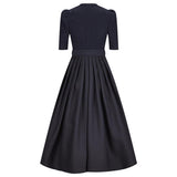 Black dress with a belt on a white background