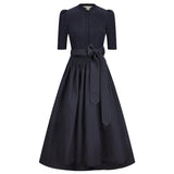 Navy blue dress with a belt on a white background
