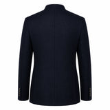 A dark navy blue blazer shown from the back, featuring a structured collar, long sleeves, and a central seam, photographed against a solid white background.