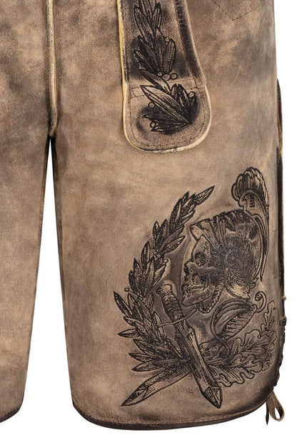 Close-up of a brown leather glove with intricate black embossed design on a white background