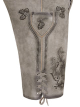 Close-up of a gray leather boot with intricate lace-up design and floral embroidery on a white background