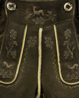 Dark fabric with embroidered patterns and decorative buttons