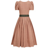 Brown checkered dress with a green belt on a white background