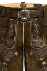 Brown leather pants with intricate embroidery and a decorative belt buckle.