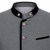 Close-up of a gray textured jacket with black velvet trim on the collar and front placket, plus decorative silver-tone buttons and a black pocket flap.