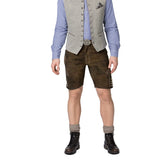 Person wearing a traditional Bavarian outfit with a vest, shirt, shorts, and boots on a white background