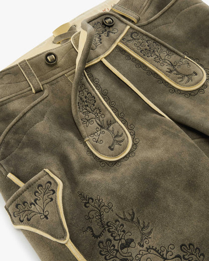 Brown leather pants with decorative stitching on a white background