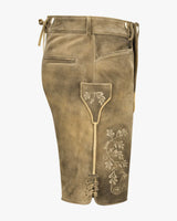 Brown pants with floral embroidery on a white background