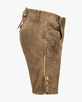 Brown leather pants with decorative elements on a white background