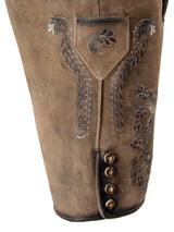 Close-up of brown leather pants with intricate embroidery and button details on a white background