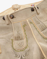 Traditional German lederhosen with embroidery on a white background