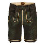 Traditional black lederhosen with green embroidery on a white background
