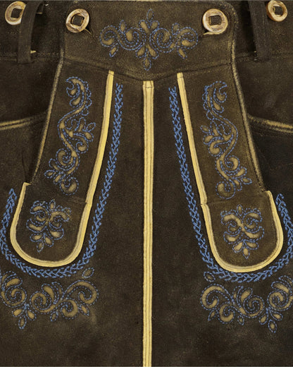 Brown leather pants with blue and gold embroidery and grommets.