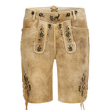 Beige leather shorts with black embroidery on a white background