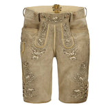 Traditional brown lederhosen with intricate embroidery on a white background